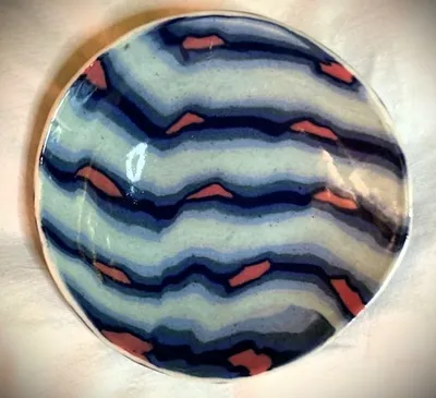 Small hand built bowl colored clay