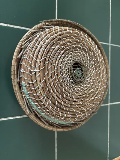 “Trout w/lid” (Fly line, flies and pine needles)